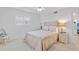 Bedroom with double bed, wicker furniture, ceiling fan at 521 W Venice Ave # 22, Venice, FL 34285