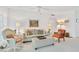 Bright living room with comfy seating, large windows, and neutral color palette at 521 W Venice Ave # 22, Venice, FL 34285