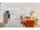 Bright living room with comfy seating, large windows, and neutral color palette at 521 W Venice Ave # 22, Venice, FL 34285