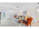 Bright living room with comfy seating, large windows, and neutral color palette at 521 W Venice Ave # 22, Venice, FL 34285