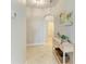 Hallway with light walls and wood console table at 5514 Tidal Breeze Cv, Bradenton, FL 34211