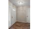 Bright entryway with wood-look tile floor and white door at 5803 Garden Lakes Majestic # 145, Bradenton, FL 34203