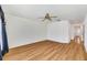 Bright bedroom with wood-look flooring and ceiling fan at 5803 Garden Lakes Palm, Bradenton, FL 34203