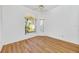 Light and airy bedroom featuring wood-look floors at 5803 Garden Lakes Palm, Bradenton, FL 34203