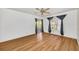 Bedroom with wood-look floors, ceiling fan and large window at 5803 Garden Lakes Palm, Bradenton, FL 34203