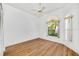 Bright bedroom with wood-look floors and large windows at 5803 Garden Lakes Palm, Bradenton, FL 34203