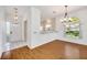 Bright dining area with wood floors and kitchen views at 5803 Garden Lakes Palm, Bradenton, FL 34203