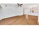 Open living room with wood floors and access to sunroom at 5803 Garden Lakes Palm, Bradenton, FL 34203