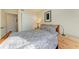 Bright bedroom with wood bed frame and large closet at 5938 Welcome Rd # H22, Bradenton, FL 34207