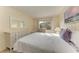 Spacious bedroom with white dresser, full bed and window at 5938 Welcome Rd # H22, Bradenton, FL 34207