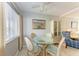 Bright dining area with glass table and wicker chairs at 5938 Welcome Rd # H22, Bradenton, FL 34207