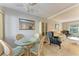 Charming dining area with glass top table at 5938 Welcome Rd # H22, Bradenton, FL 34207