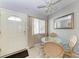 Cozy dining area with glass table and wicker chairs at 5938 Welcome Rd # H22, Bradenton, FL 34207