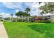 Building exterior showcasing manicured landscaping at 5938 Welcome Rd # H22, Bradenton, FL 34207