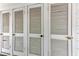 White louvered doors on exterior wall at 5938 Welcome Rd # H22, Bradenton, FL 34207