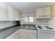 Galley kitchen offers ample counter space and appliances at 5938 Welcome Rd # H22, Bradenton, FL 34207