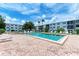 Refreshing community pool with lounge chairs and patio area at 5938 Welcome Rd # H22, Bradenton, FL 34207