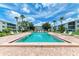 Refreshing community pool with lounge chairs at 5938 Welcome Rd # H22, Bradenton, FL 34207