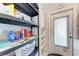 Storage shelves with various household items at 5938 Welcome Rd # H22, Bradenton, FL 34207