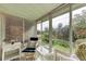 Bright sunroom features stunning nature views and comfy seating at 5938 Welcome Rd # H22, Bradenton, FL 34207