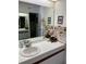 Bathroom with double vanity and large mirror at 6304 Pointe West Blvd # A203, Bradenton, FL 34209