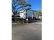 White two-story building with parking lot and landscaping at 6304 Pointe West Blvd # A203, Bradenton, FL 34209