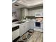 Kitchen with white appliances and light cabinets at 6304 Pointe West Blvd # A203, Bradenton, FL 34209