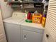 Stackable washer and dryer in a well-lit laundry closet at 6304 Pointe West Blvd # A203, Bradenton, FL 34209