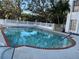 Community swimming pool with brick coping and steps at 6304 Pointe West Blvd # A203, Bradenton, FL 34209