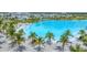 Aerial view of community pool, palm trees, and homes at 6404 Pigeon Plum Way, Bradenton, FL 34210