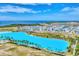 Aerial view of waterfront community with lagoon at 6404 Pigeon Plum Way, Bradenton, FL 34210