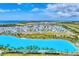 Aerial view of waterfront community with lagoon at 6404 Pigeon Plum Way, Bradenton, FL 34210