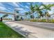 View of the Aqua community entrance gate and landscaping at 6404 Pigeon Plum Way, Bradenton, FL 34210