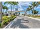 View of the Aqua community entrance gate and paved road at 6404 Pigeon Plum Way, Bradenton, FL 34210