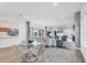 Open dining area with hardwood floors, and a view into the living room at 6404 Pigeon Plum Way, Bradenton, FL 34210