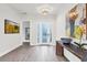 Bright and airy entryway with hardwood floors and art at 6404 Pigeon Plum Way, Bradenton, FL 34210