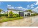 Modern home exterior with gray garage door at 6404 Pigeon Plum Way, Bradenton, FL 34210