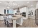 Modern kitchen with white cabinets and an island at 6404 Pigeon Plum Way, Bradenton, FL 34210
