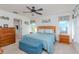 Spacious main bedroom with a king-size bed and ensuite bathroom access at 6605 63Rd E Ave, Palmetto, FL 34221