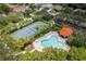 Aerial view of community pool, tennis, and basketball courts at 6650 Cheswick St, Sarasota, FL 34243