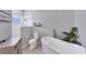 Bathroom with a walk-in shower and a freestanding bathtub at 6650 Cheswick St, Sarasota, FL 34243
