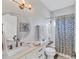 Updated bathroom features a shower, new vanity, and modern fixtures at 6650 Cheswick St, Sarasota, FL 34243