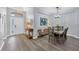 Bright dining room with a table, chairs, and hardwood floors at 6650 Cheswick St, Sarasota, FL 34243