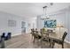 Bright dining room with a wood table and seating for six at 6650 Cheswick St, Sarasota, FL 34243