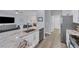Kitchen boasts granite countertops, stainless steel appliances, and light wood flooring at 6650 Cheswick St, Sarasota, FL 34243
