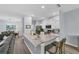 Modern kitchen with white cabinets, granite island, and stainless steel appliances at 6650 Cheswick St, Sarasota, FL 34243