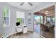 Home office with window views and access to a screened patio at 6650 Cheswick St, Sarasota, FL 34243