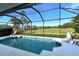 Relaxing screened pool and patio area overlooking the golf course at 676 Planters Manor Way, Bradenton, FL 34212