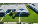An aerial view of a single story home with a tile roof and green lawn at 6810 9Th W Ave, Bradenton, FL 34209