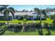 An aerial view showcasing a single story home with a lush green yard at 6810 9Th W Ave, Bradenton, FL 34209